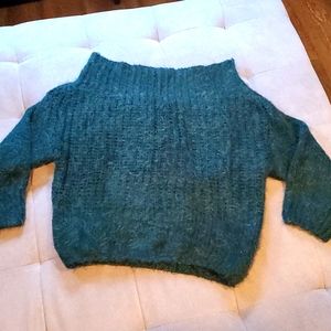 Green knit sweater.